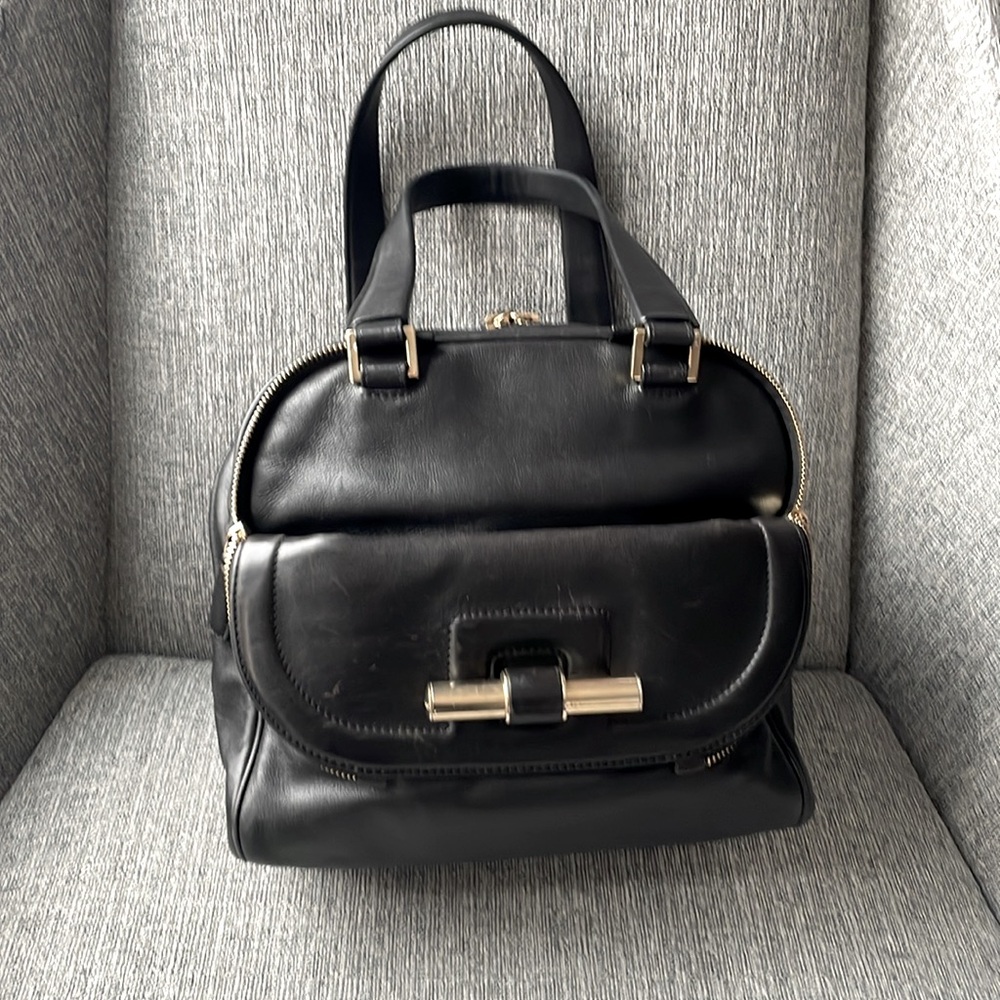 Jimmy Choo black leather handbag with gold zippers and hardware